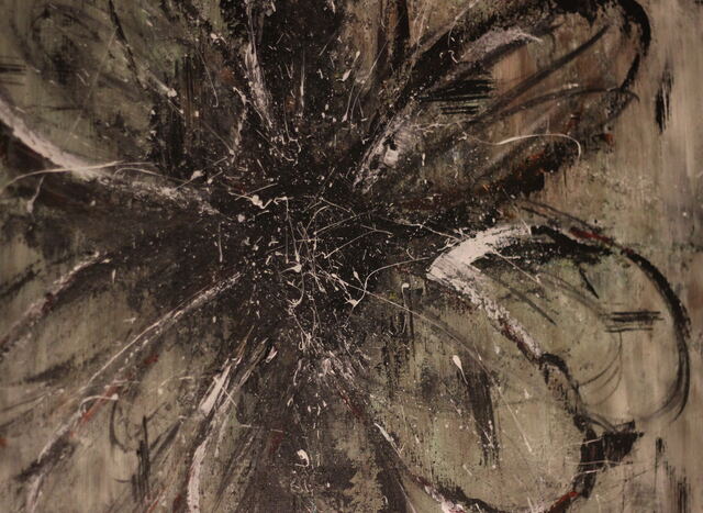 Abstract painting of a large flower in charcoal, black and silver with splattered highlights